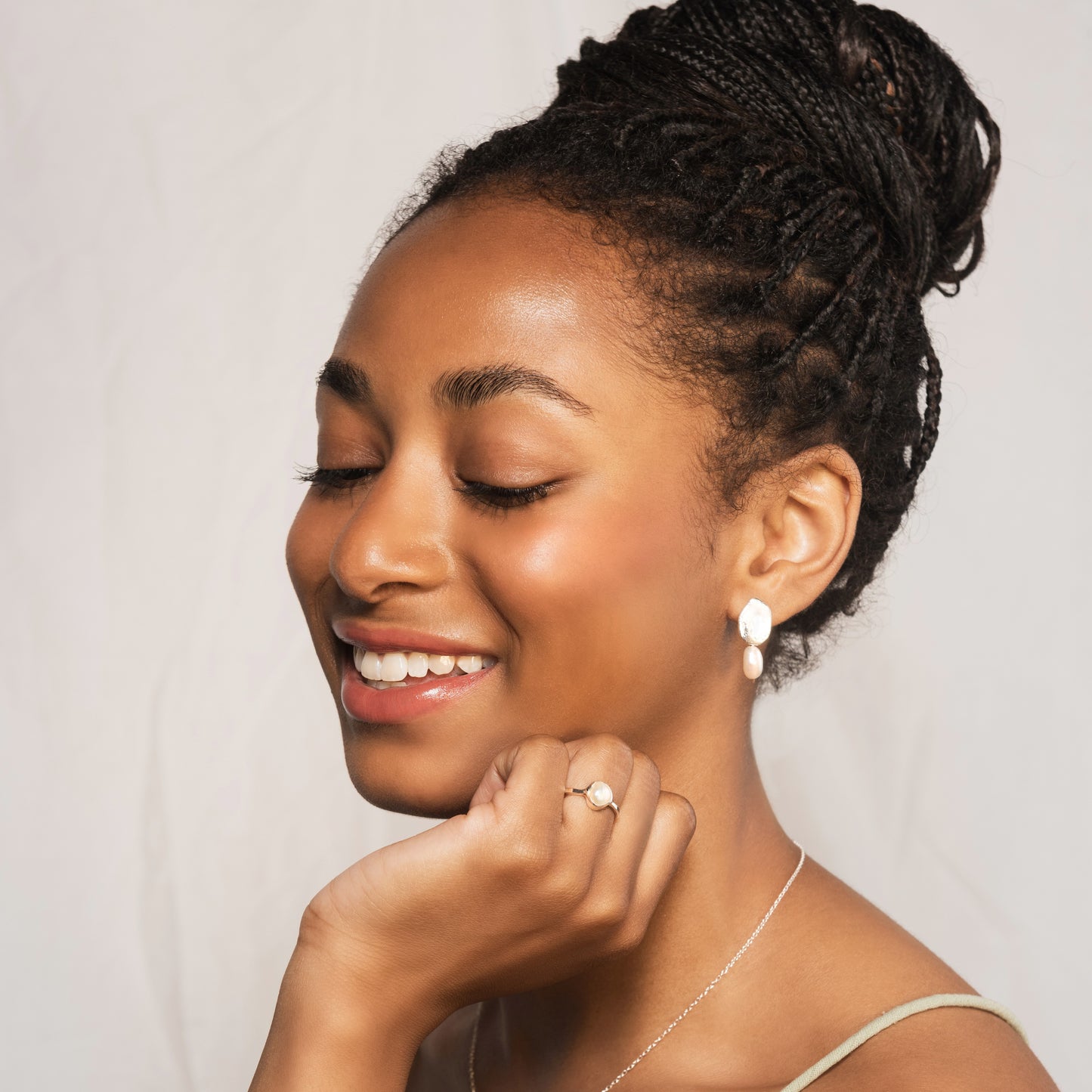 model wearing Bella earrings and silver pearl ring