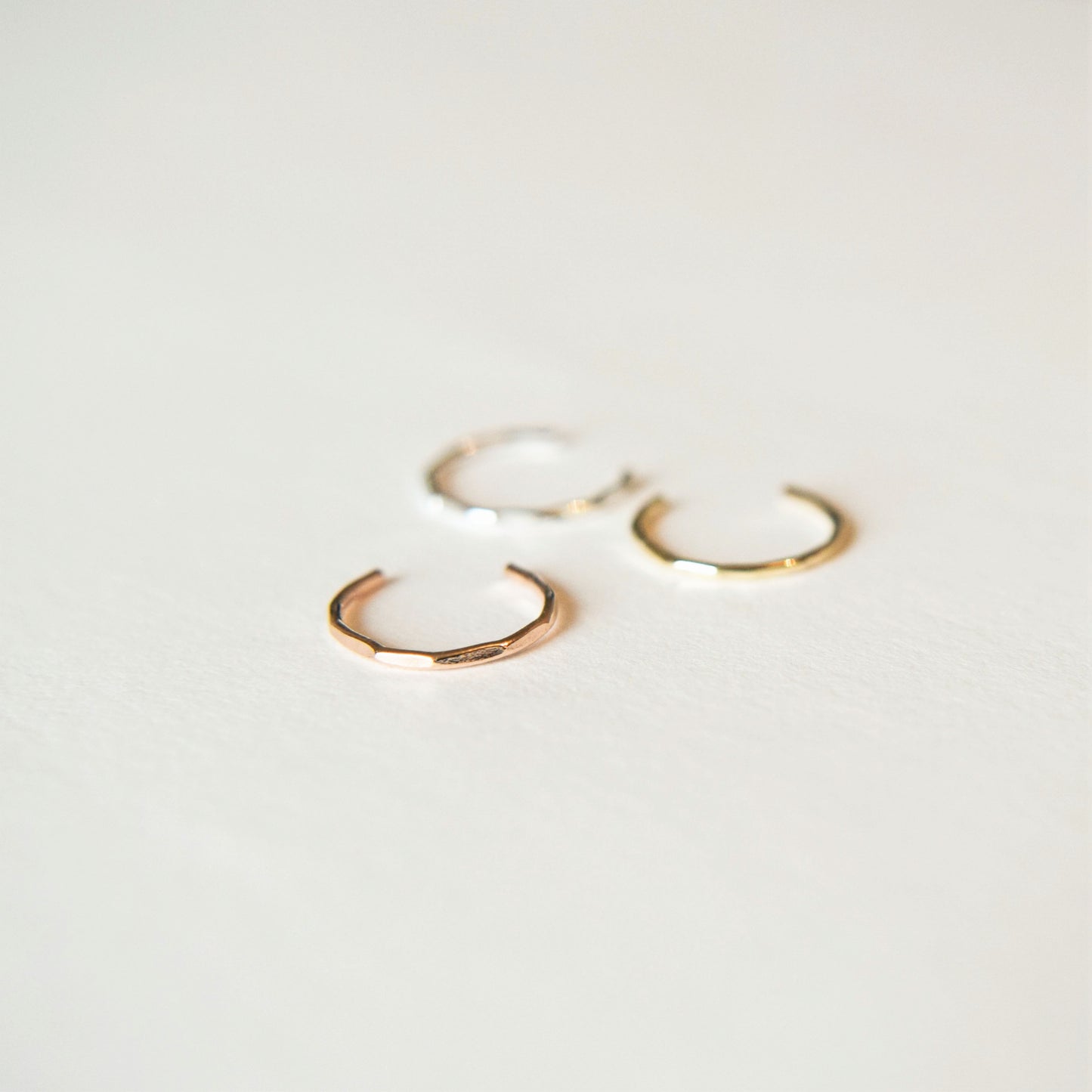 product image showing three ear cuffs on a white background