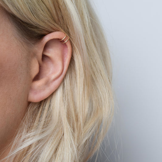 9ct gold double helix cuff worn on blond model