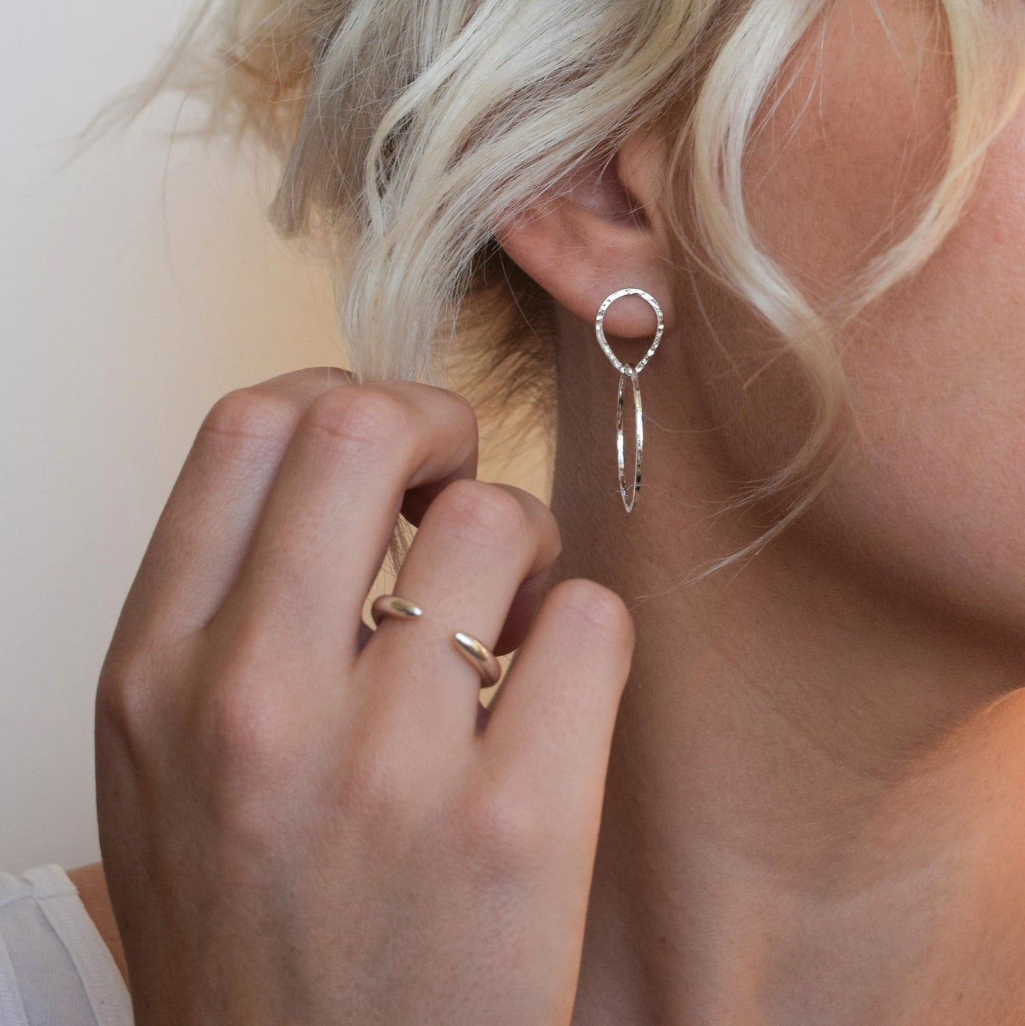 Cuff ring worn alongside Teardrop circle earrings