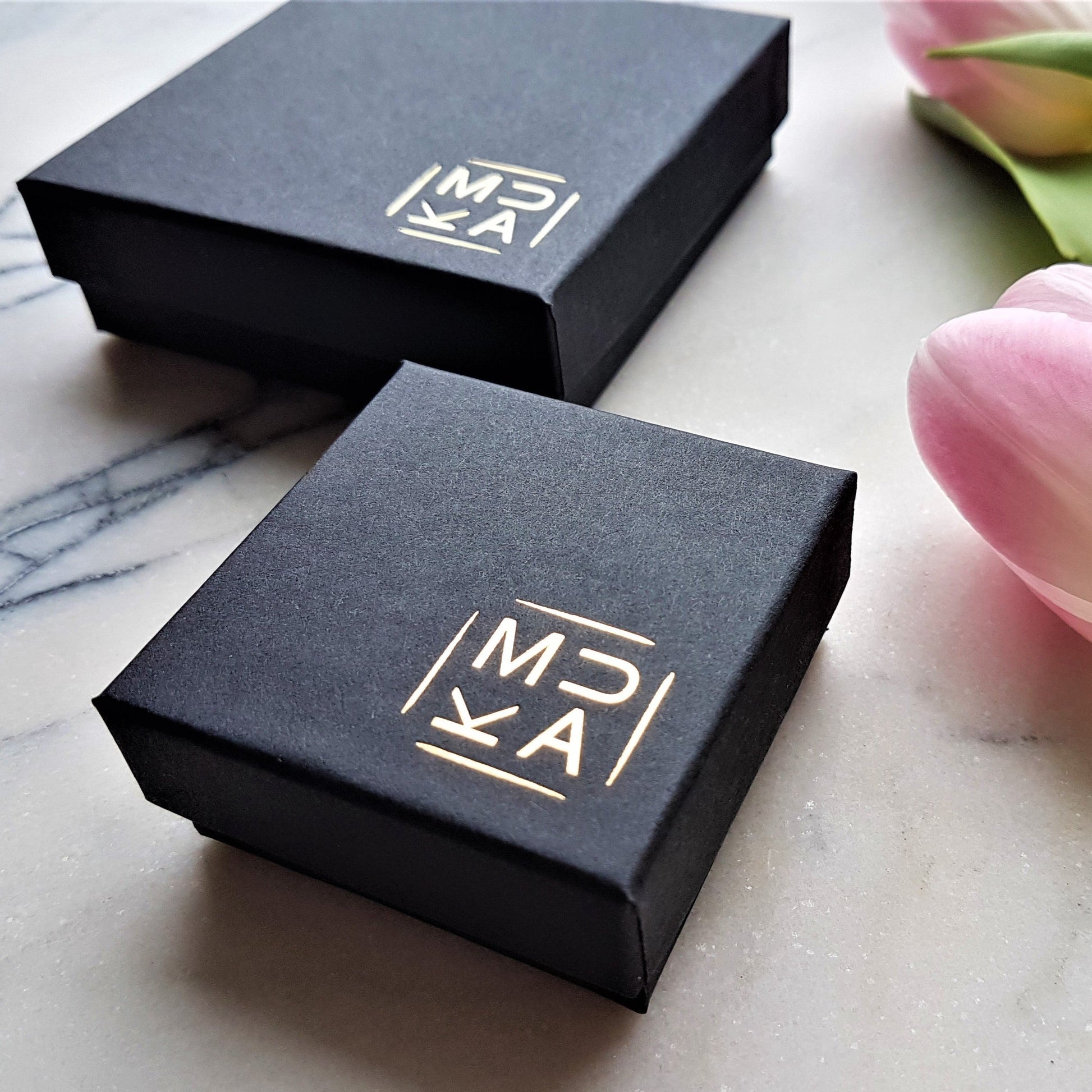 MUKA branded jewellery boxes, black box with gold logo