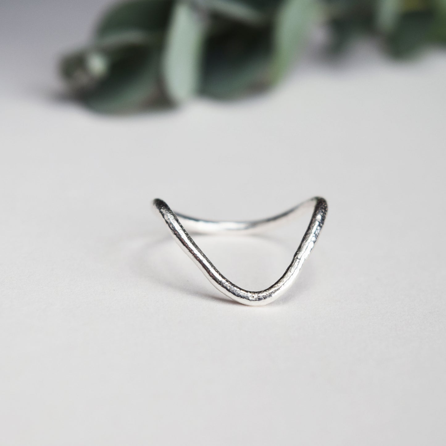 Deep V ring on white background