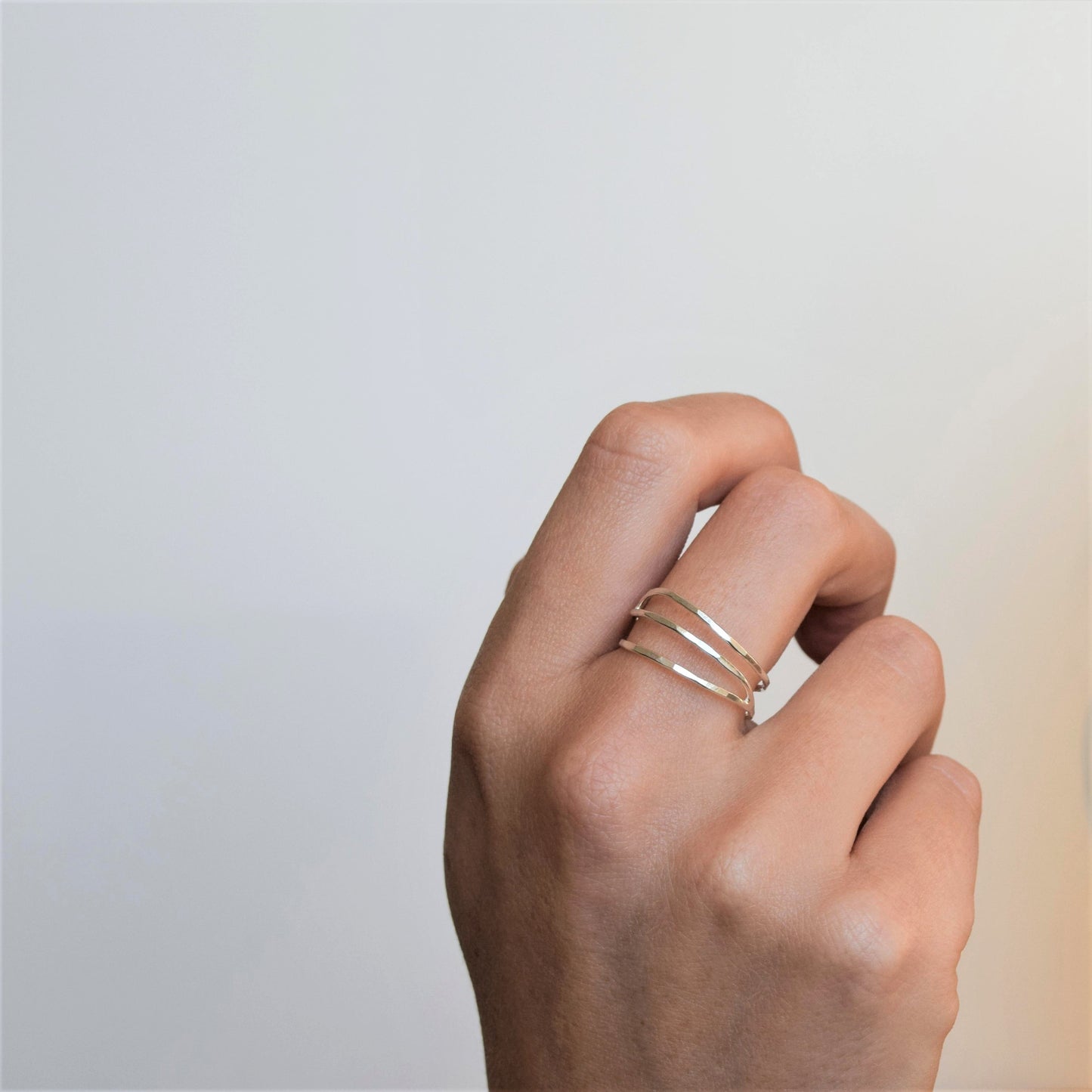 Silver wave ring on hand
