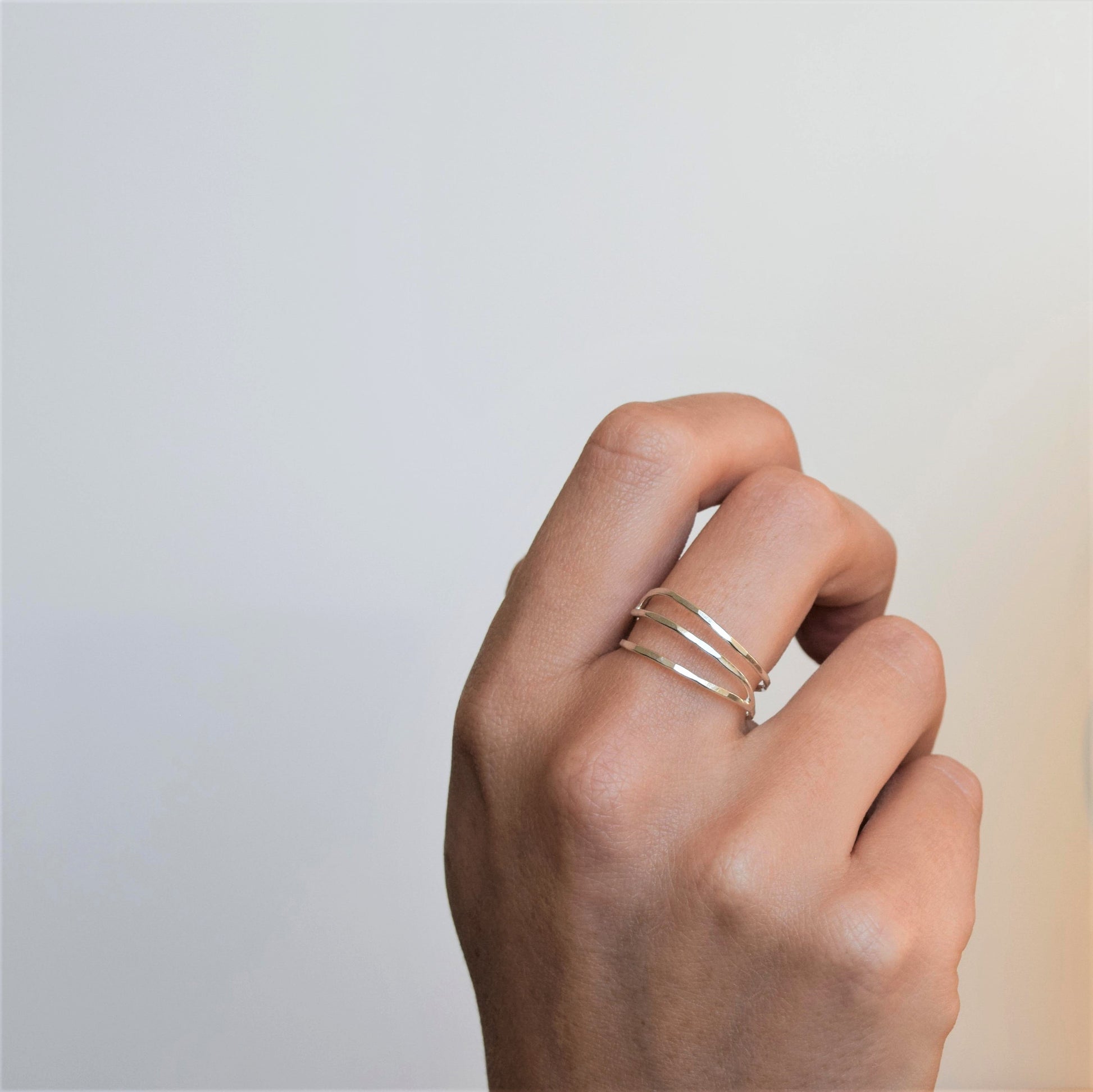 Silver wave ring on hand