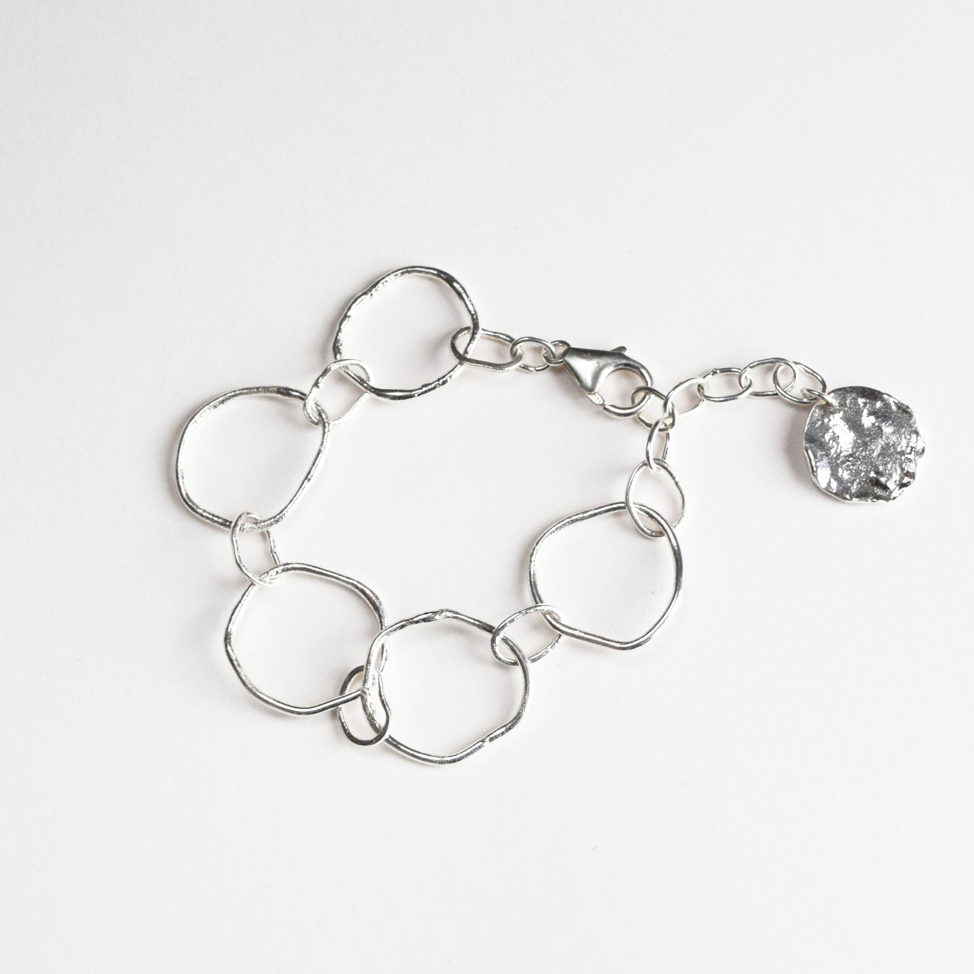 Molten link bracelet on white background