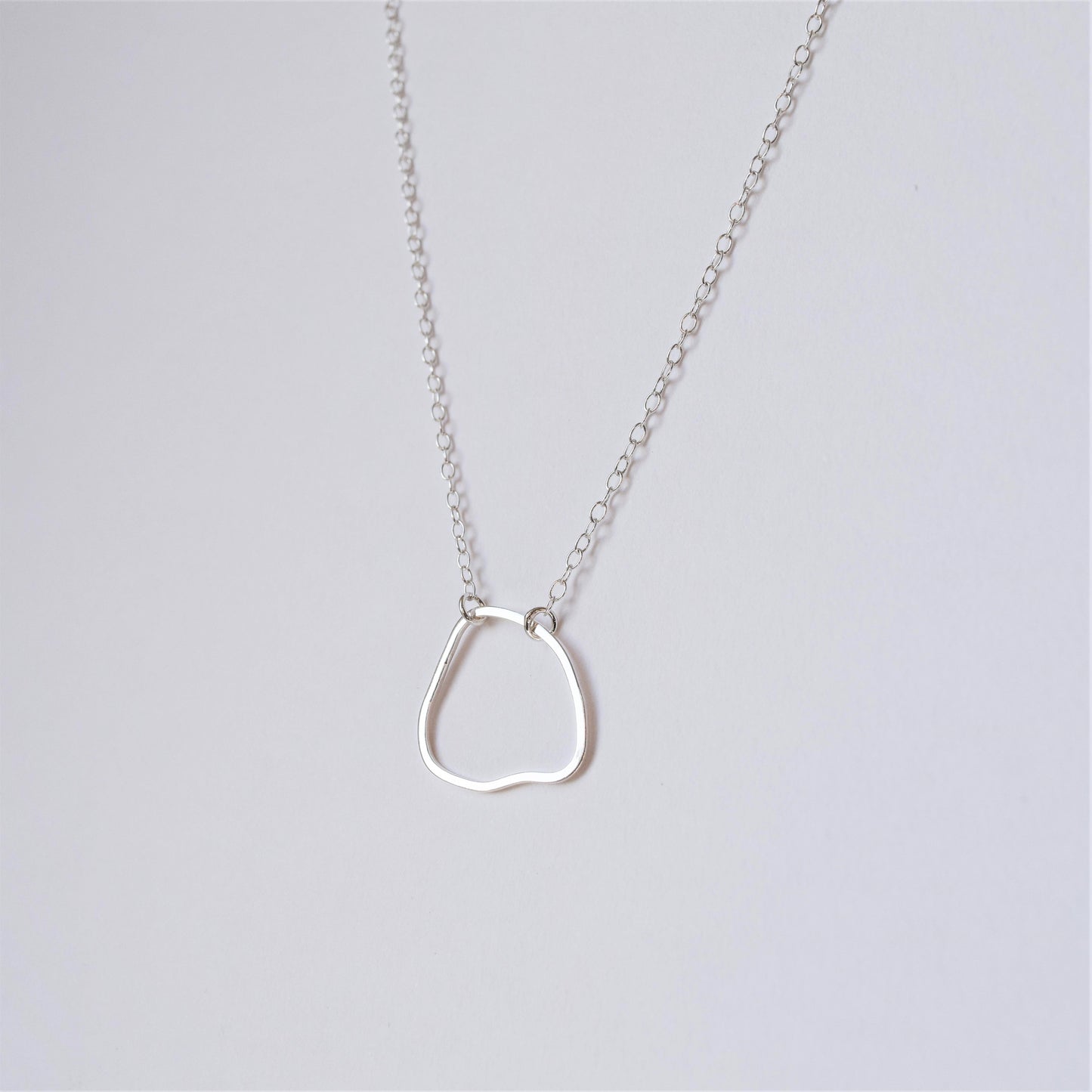 Irregular shaped silver pendant by MUKA studio handmade jewellery