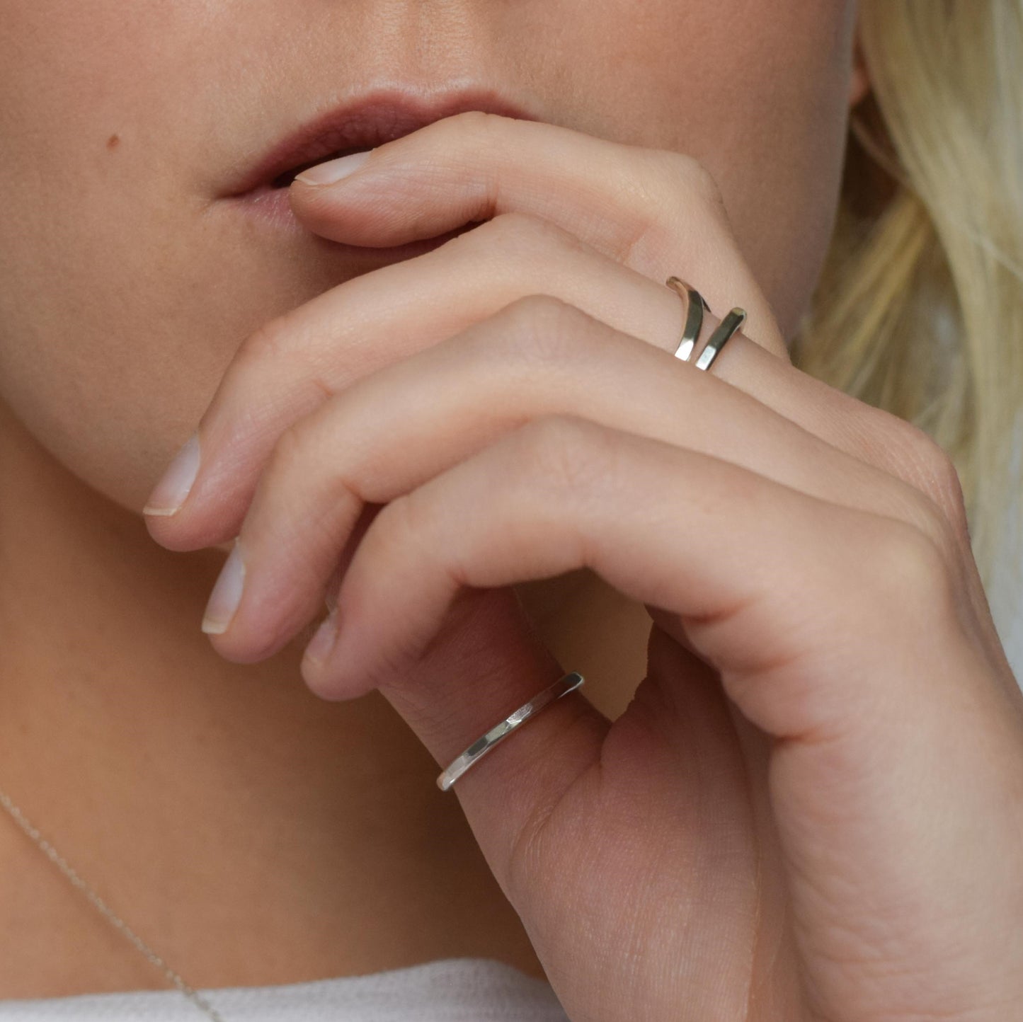 Chevron stacking rings worn over several fingers