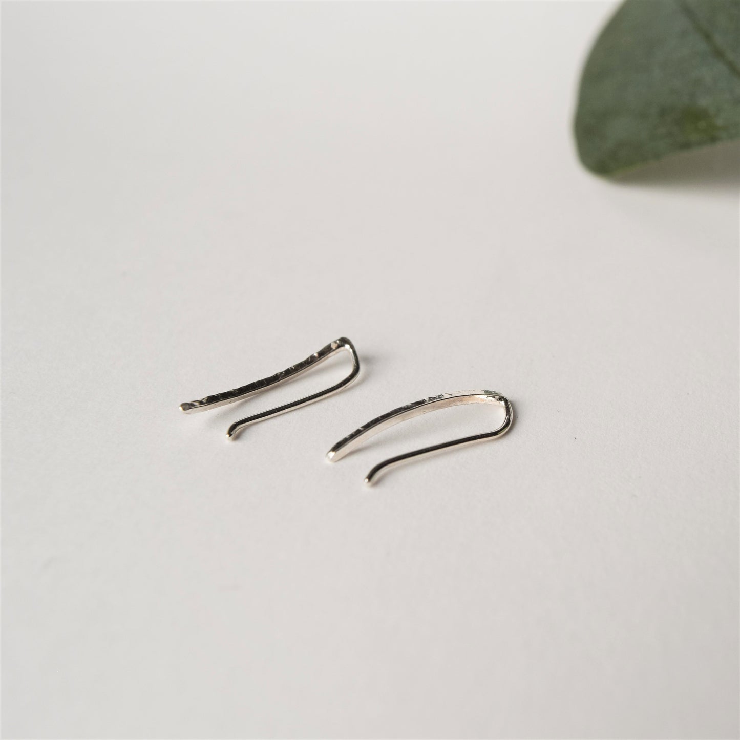 Product image showing smooth ear climbers on white background