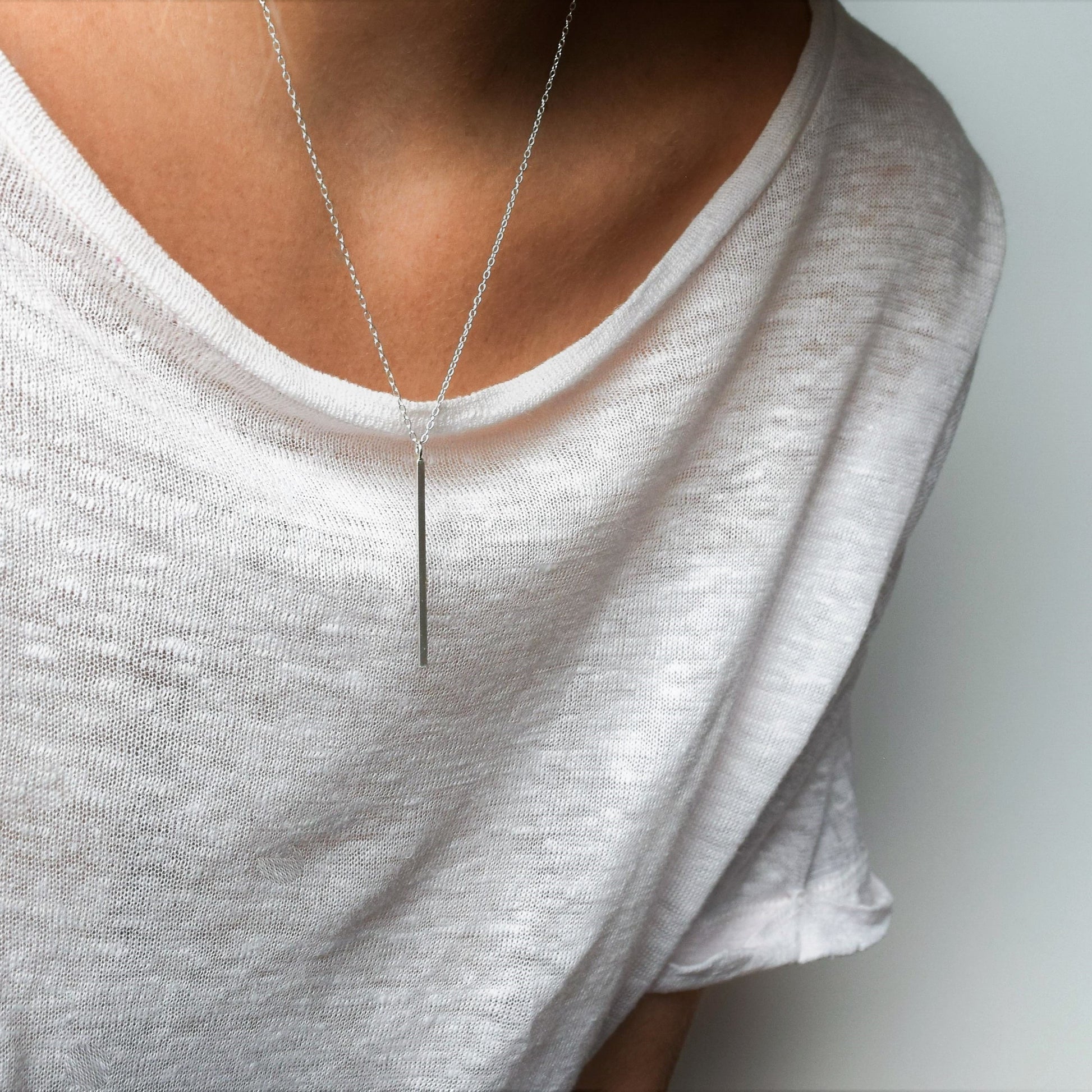 Vertical bar necklace on model