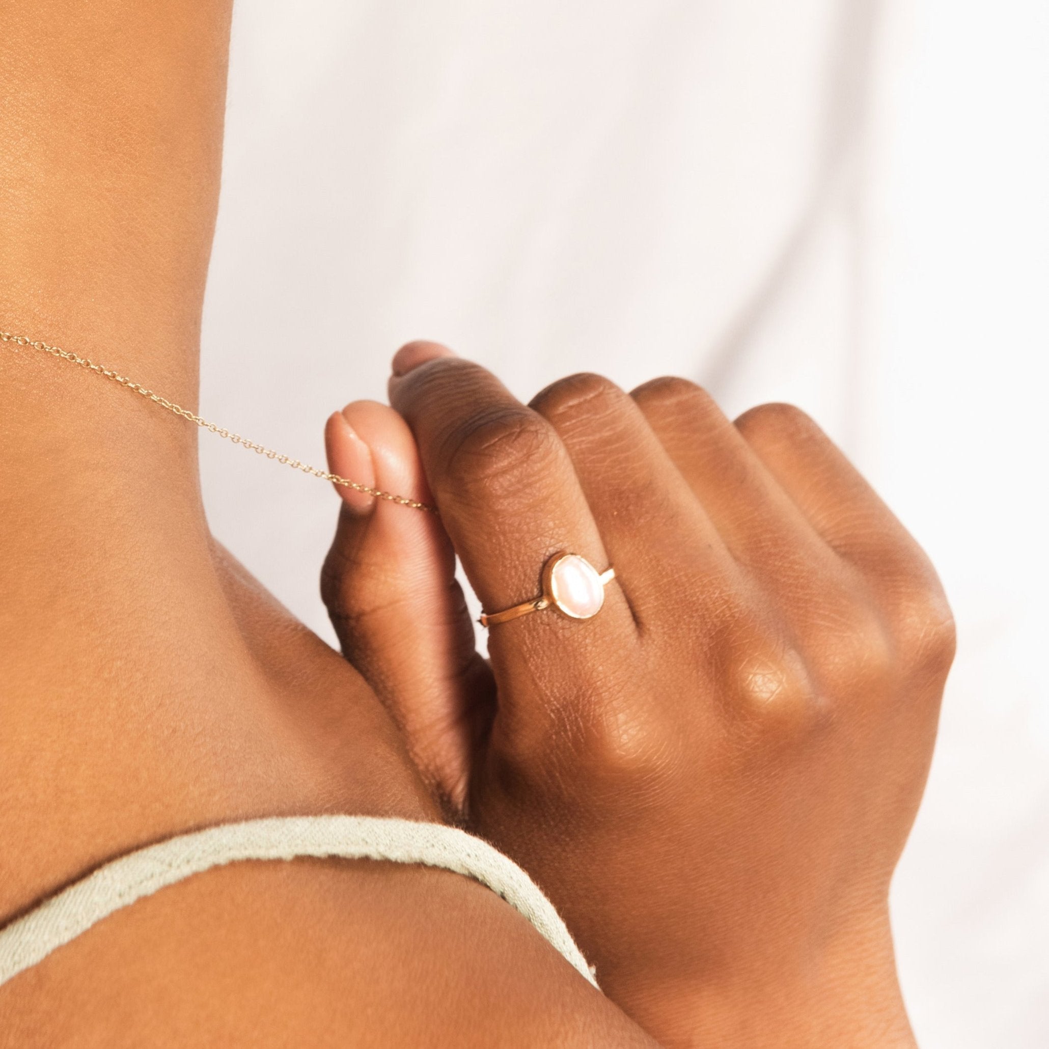 Model wearing a recycled silver pearl ring