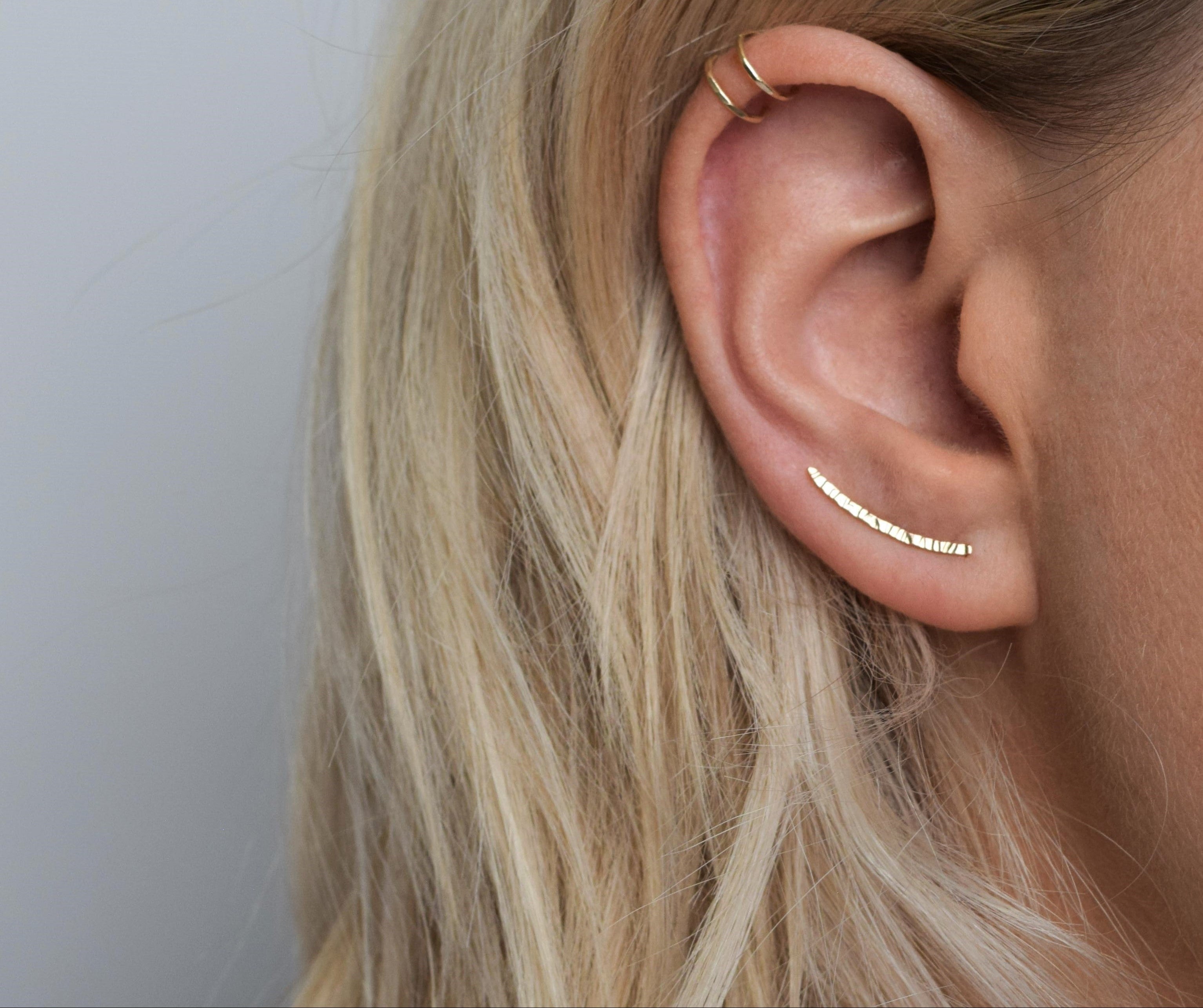 Solid gold ear climbers and double helix cuff handmade in Scotland designed to be worn everyday