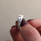Recycled silver wave ring with citrine, pink sapphire and emerald stones set into the silver band. Colorful and fun ring handmade in UK
