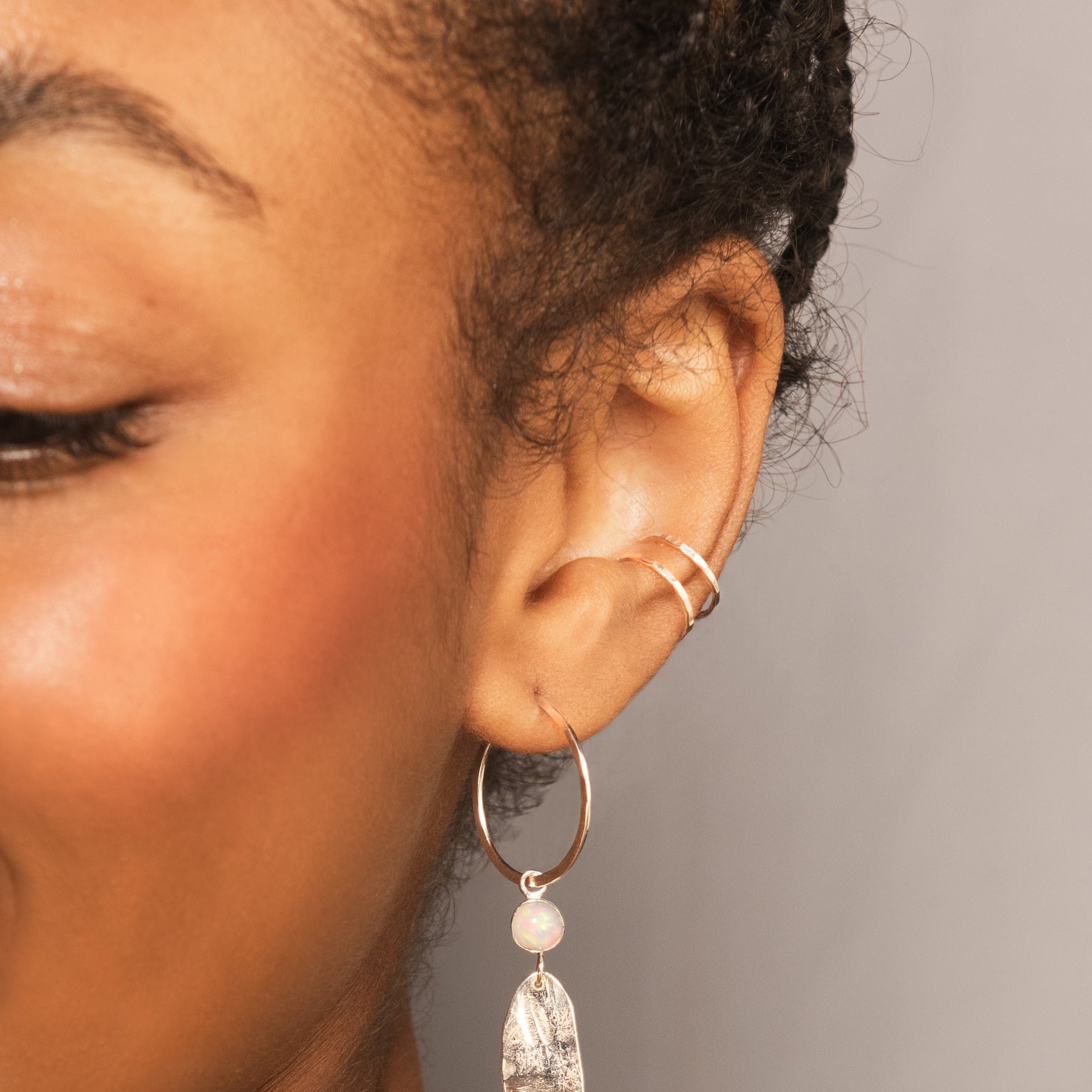 Model wearing double conch cuff in silver