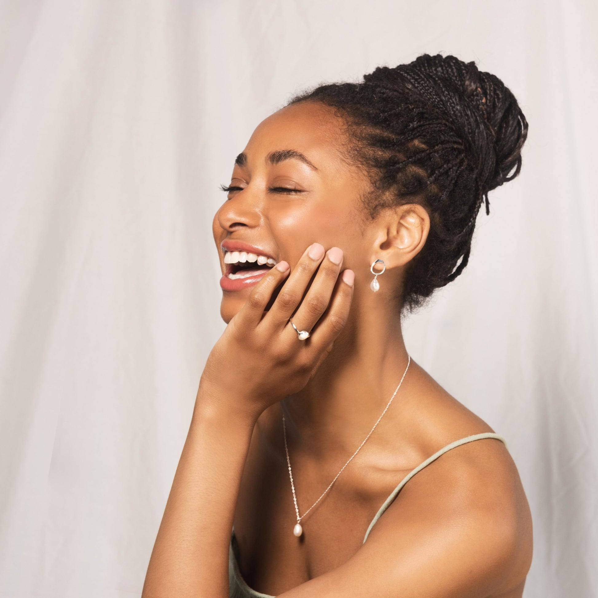 model wears grace earrings alongside other pieces from the Grace collection