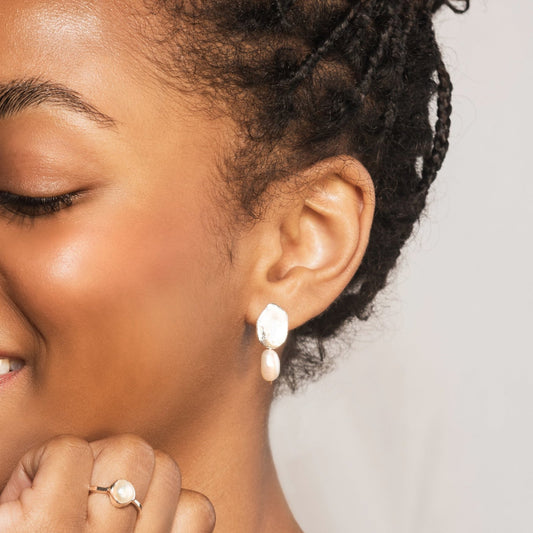 Model wears bella earrings and silver pearl ring