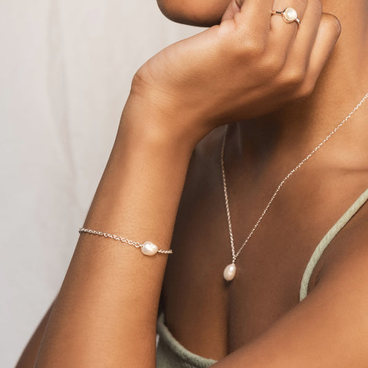 close up of model wearing silver pearl bracelet