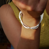 Organic pebble shaped silver bangle handmade in Glasgow UK
