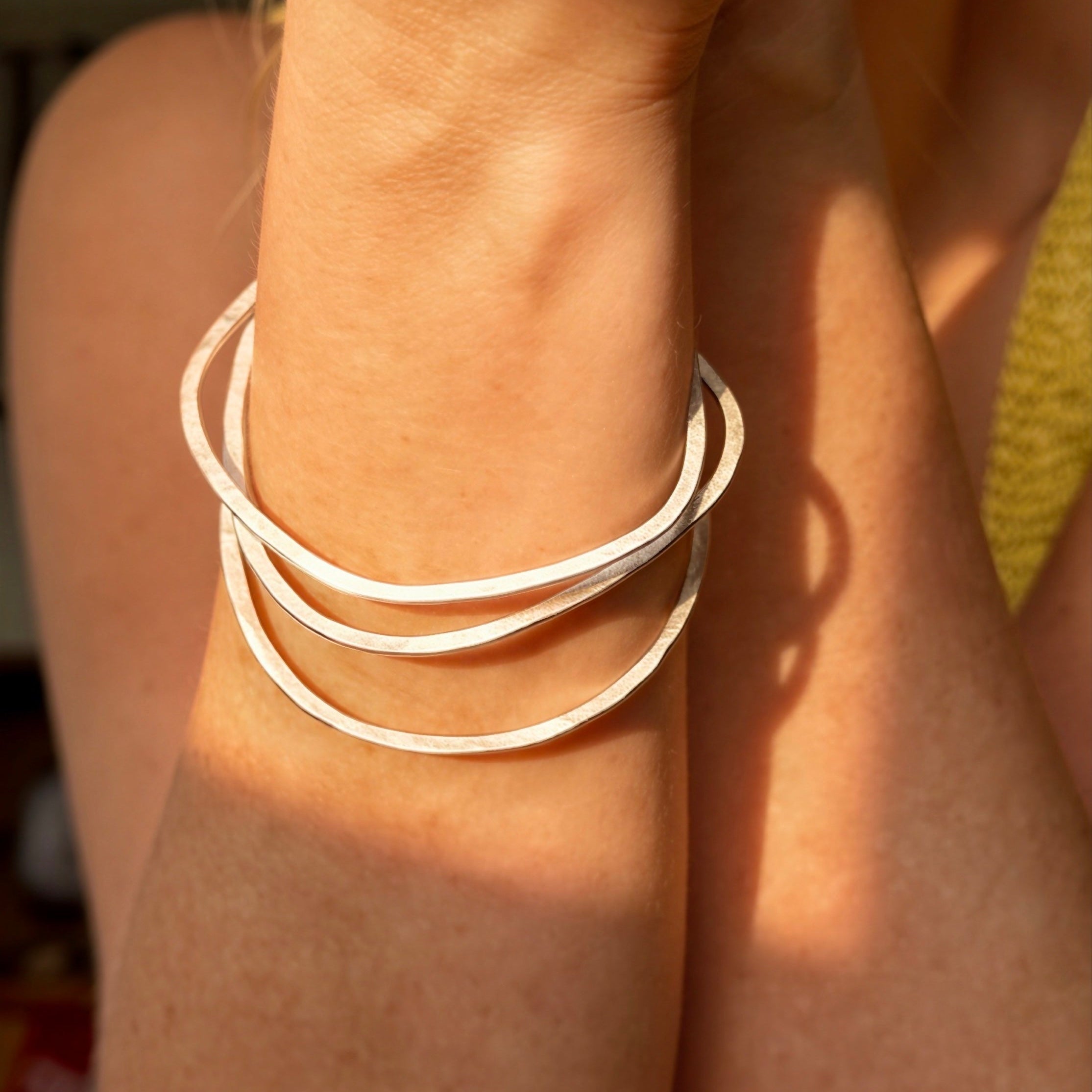organic shape bangles handmade in recycled sterling silver Glasgow, UK