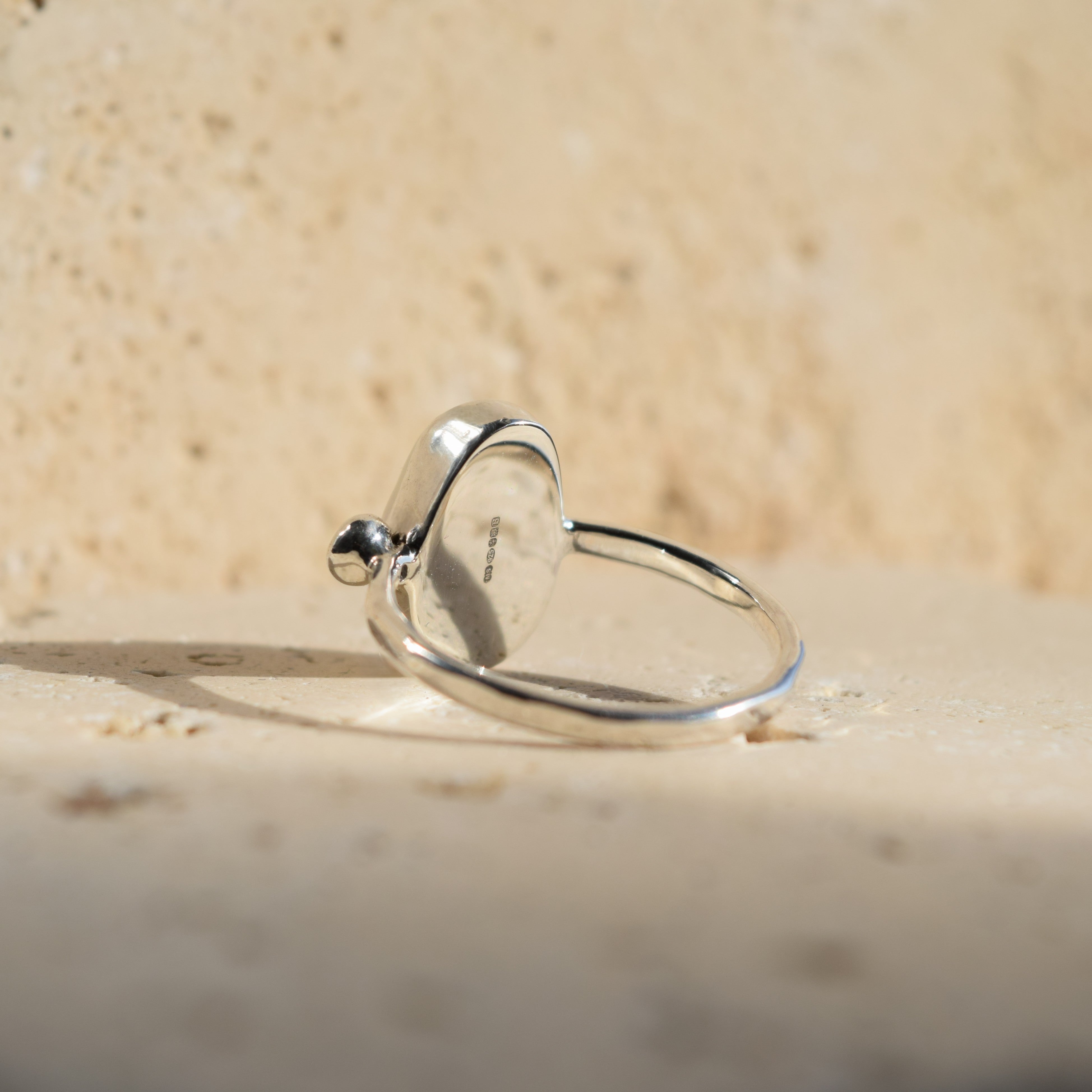 Image showing the official hallmark on the underside of the pearl and diamond ring