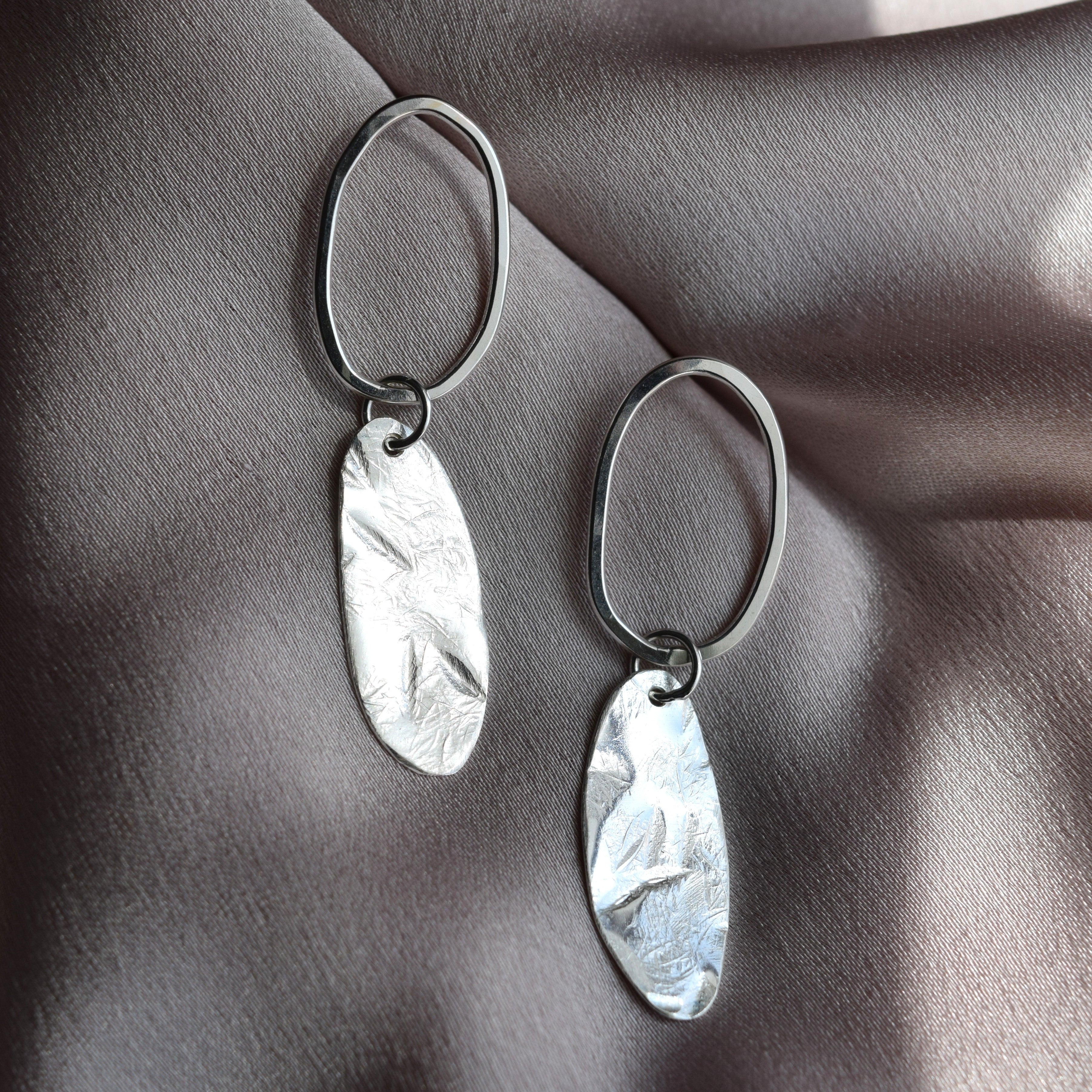 Hammered silver drop earrings handmade in UK, solid oval textured drops hand freely from silver ovals