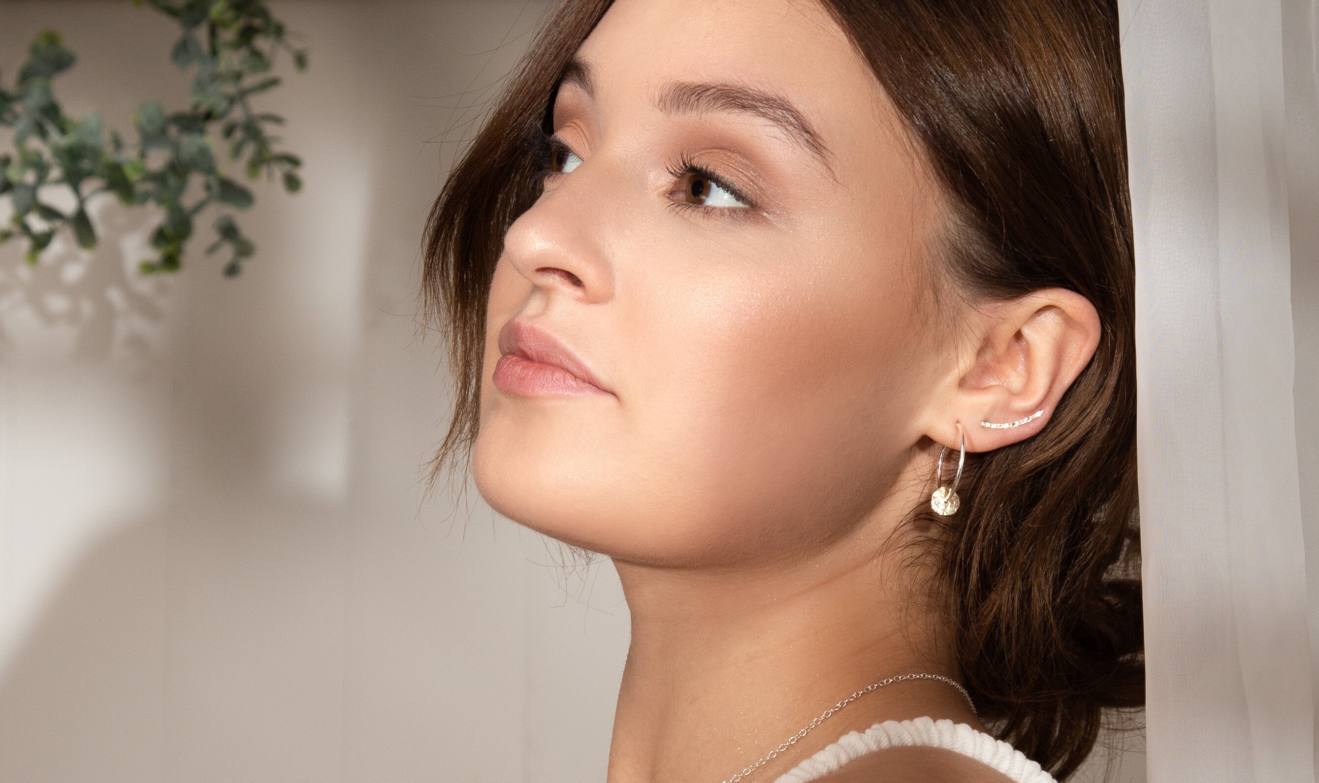 Silver and gold ear stacking with hoop earrings and ear climbers handmade in recycled silver