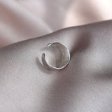 Silver ear cuff with molten texture handmade in recycled silver UK