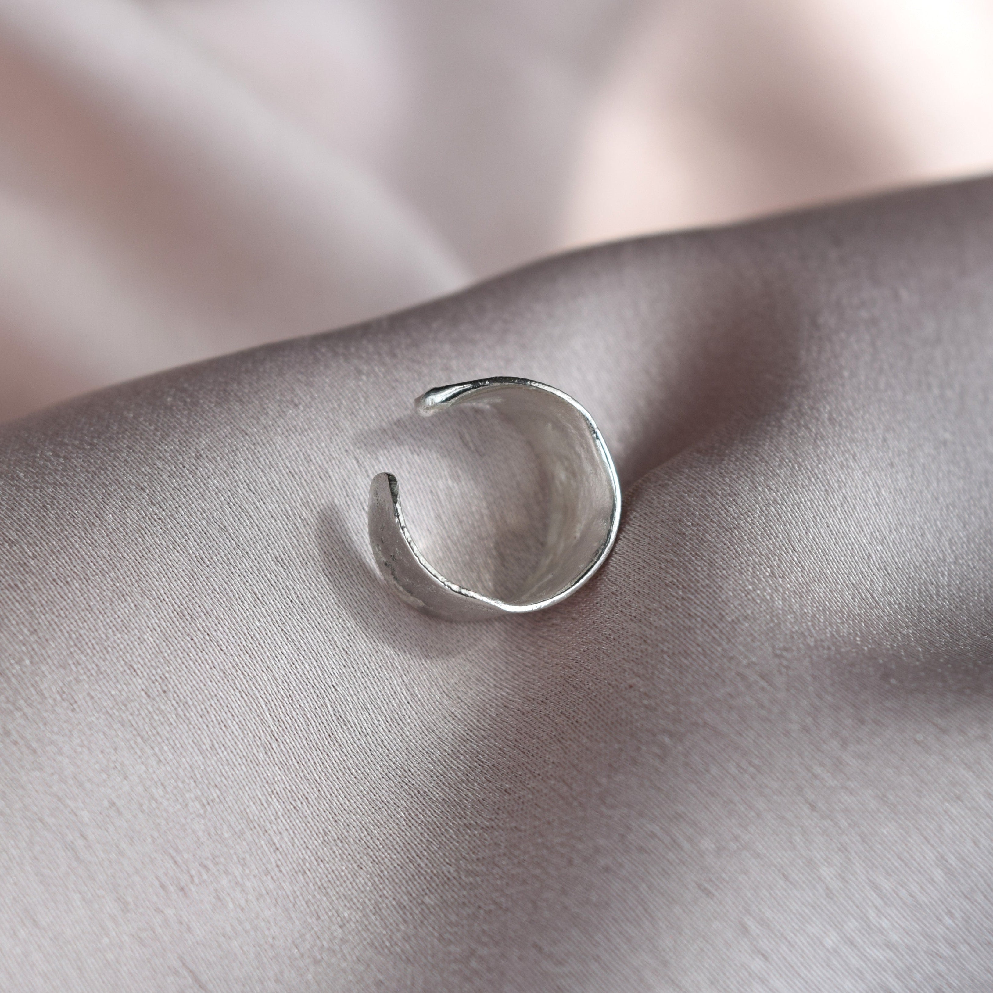 Silver ear cuff with molten texture handmade in recycled silver UK