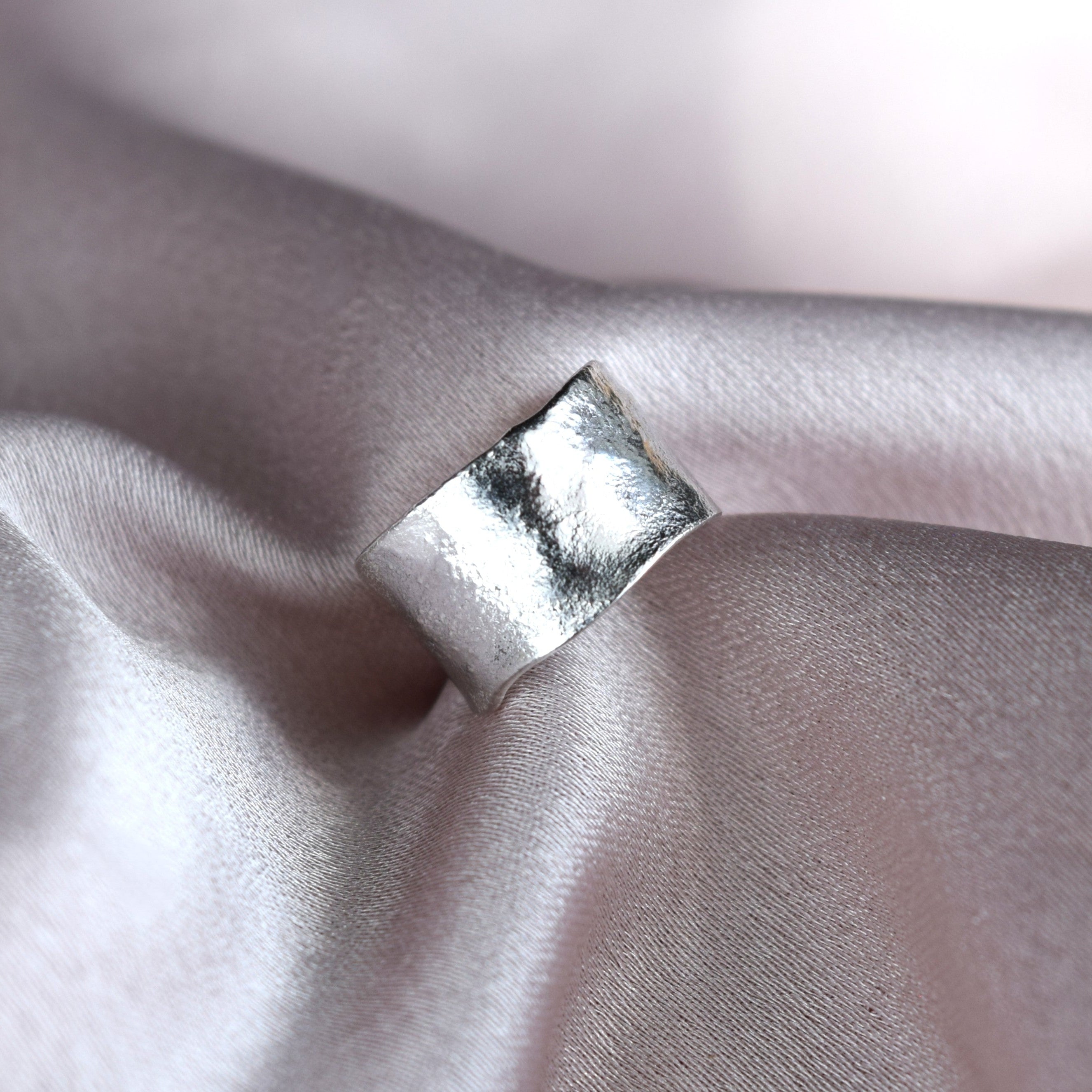 Silver ear cuff with molten texture handmade in recycled silver UK