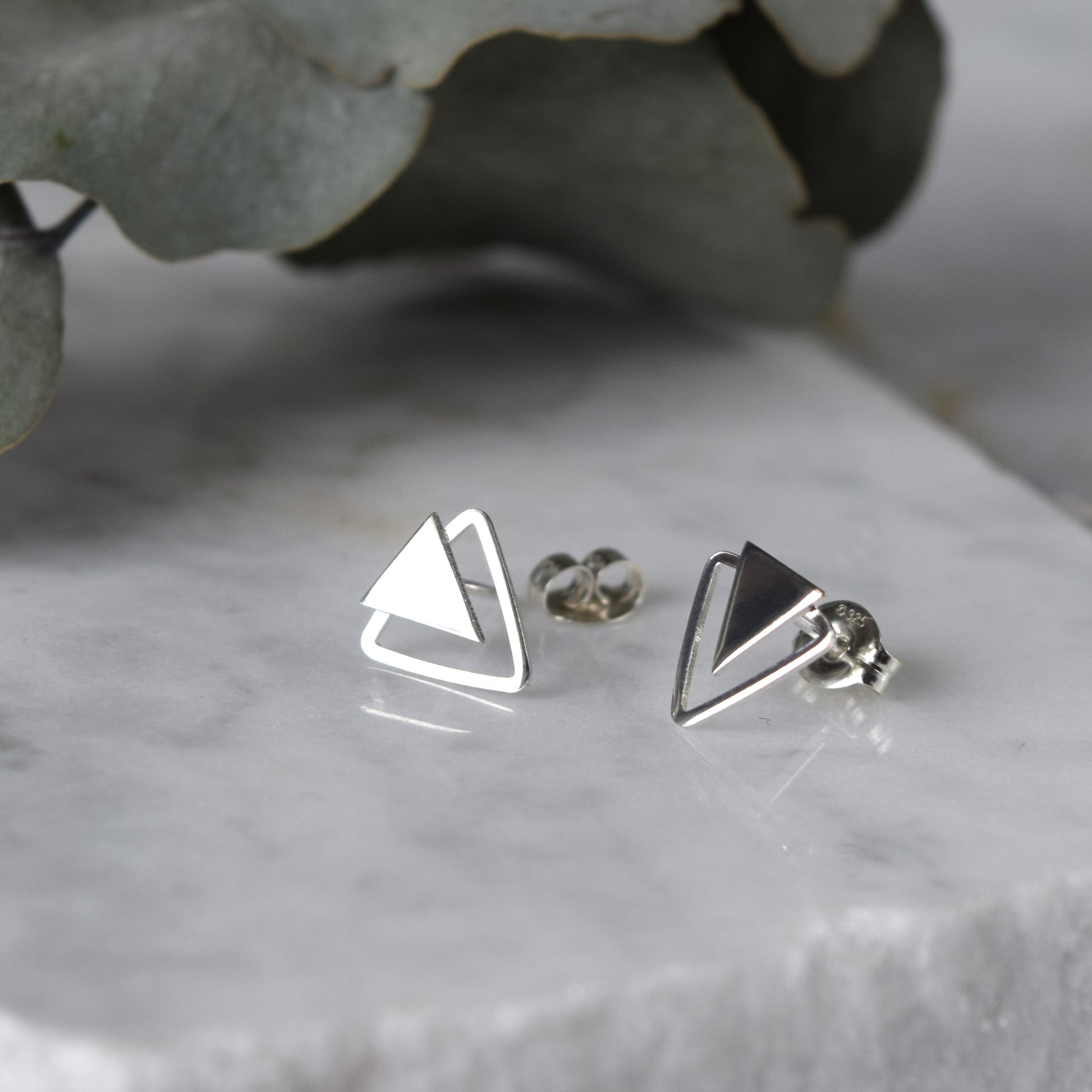 product image of double triangle earrings on white background