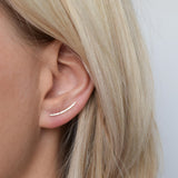 9ct gold hammered ear climbers being worn by blonde haired model