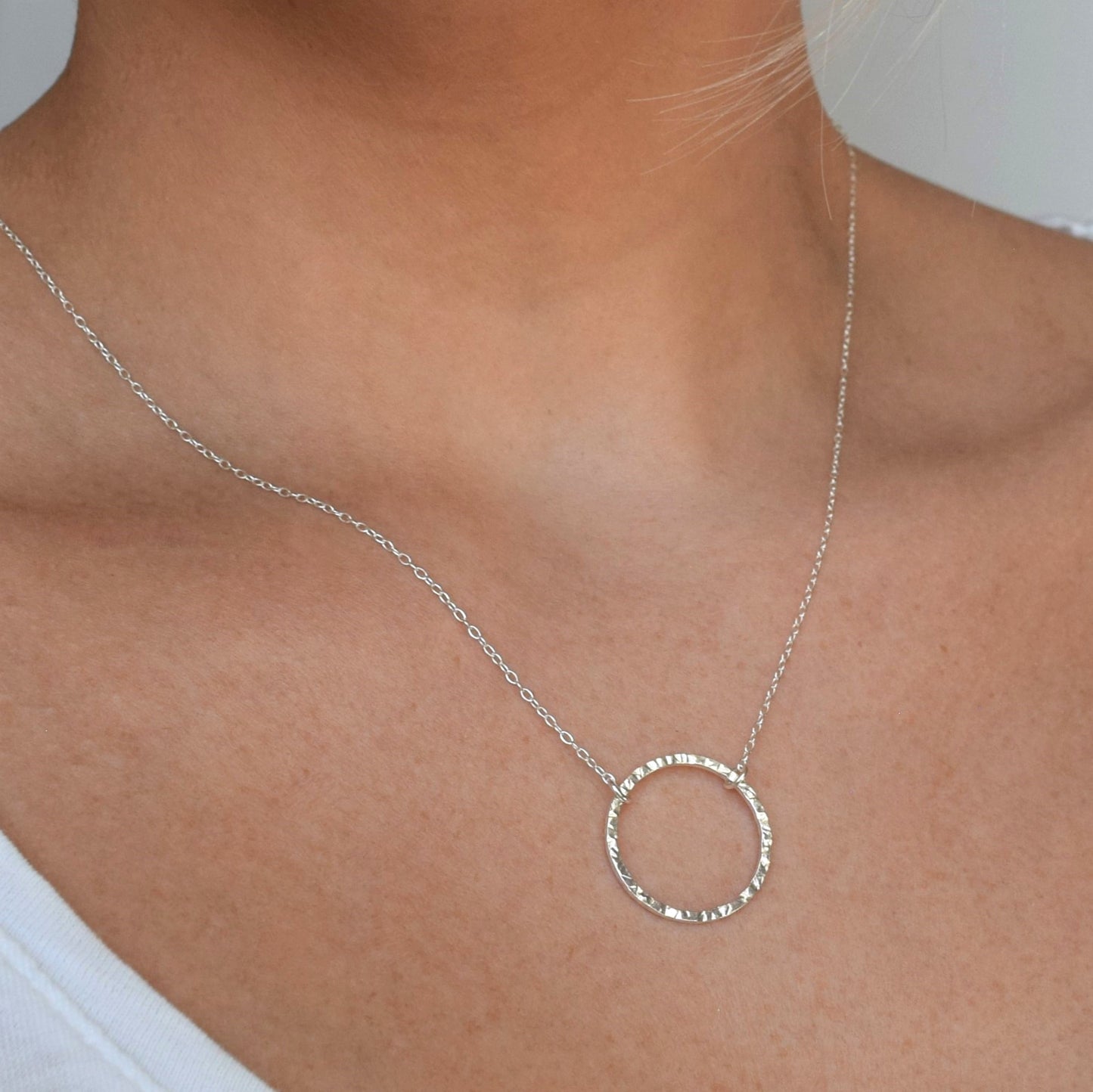 Textured silver circle necklace, length 18", worn by model