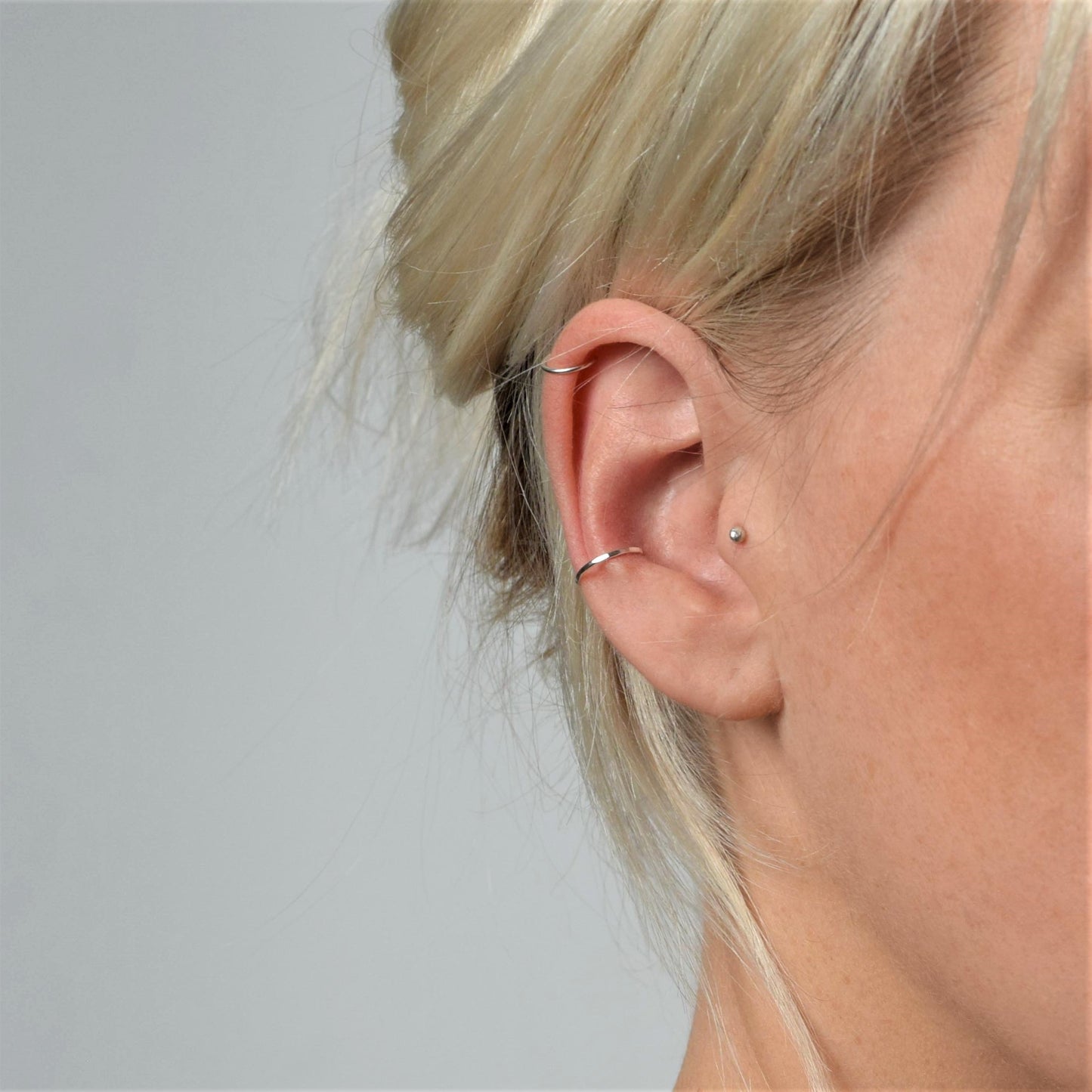 tragus stud work alongside conch and helix cuffs