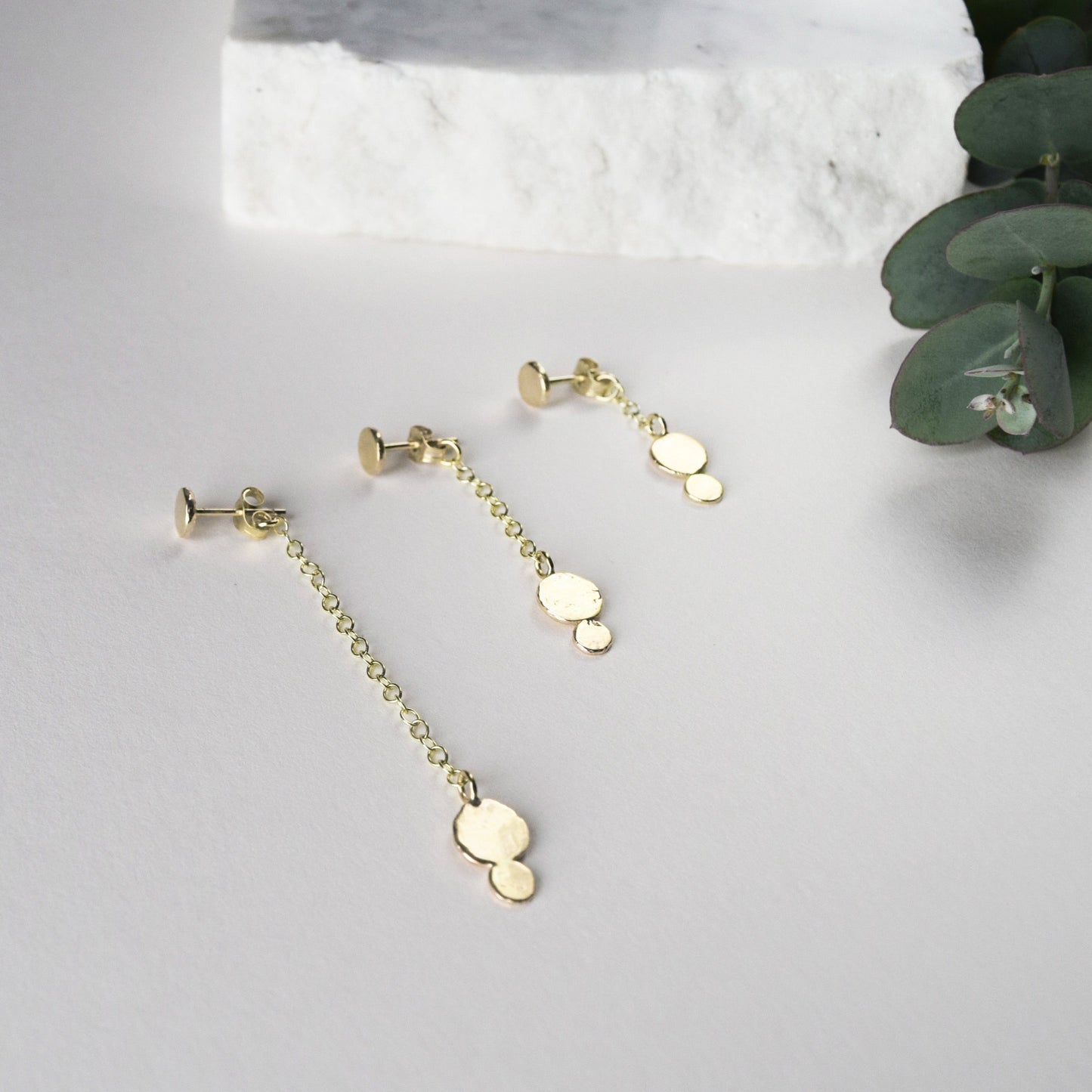 Product image showing the three different lengths of the gold Ella earring 