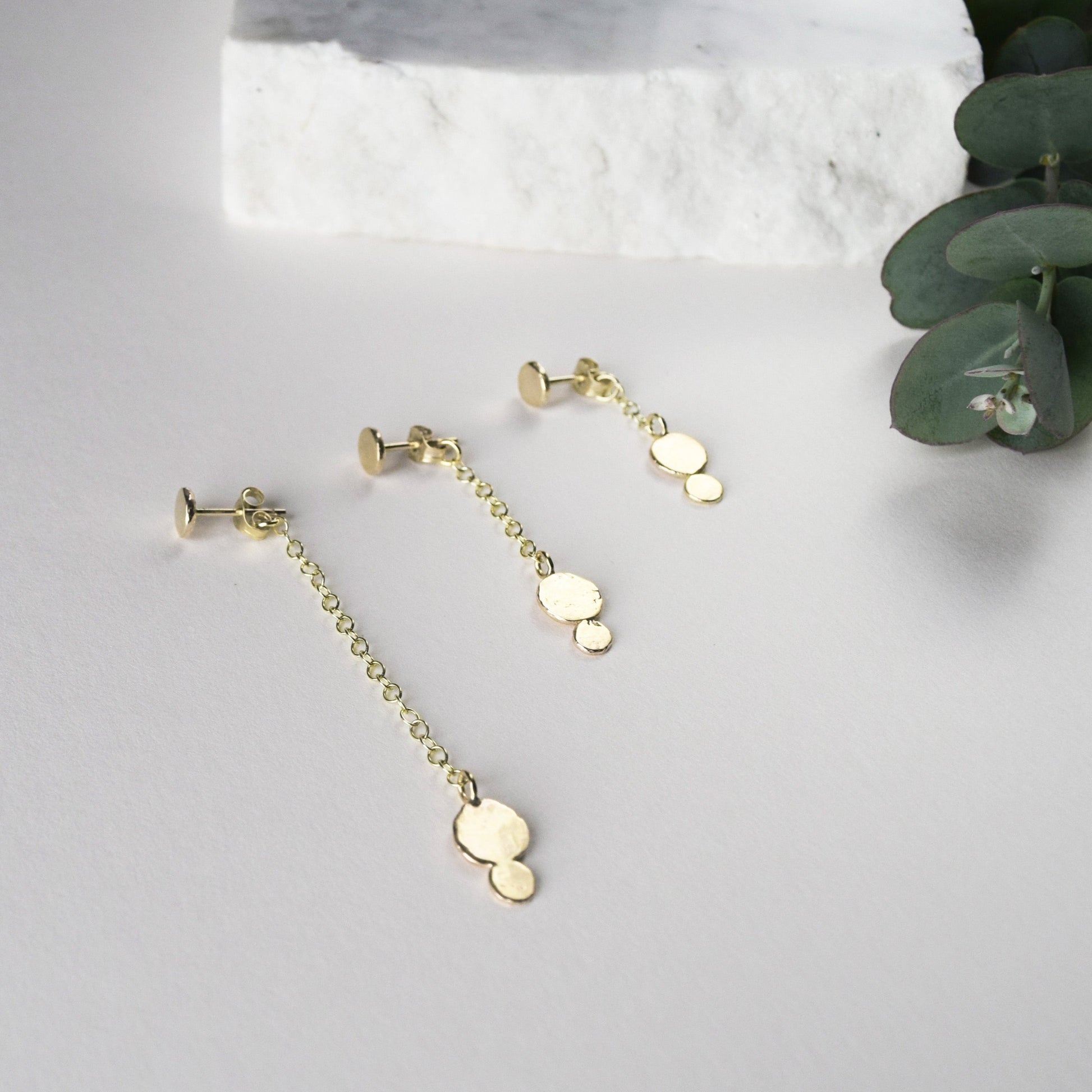 Product image showing the three different lengths of the gold Ella earring 