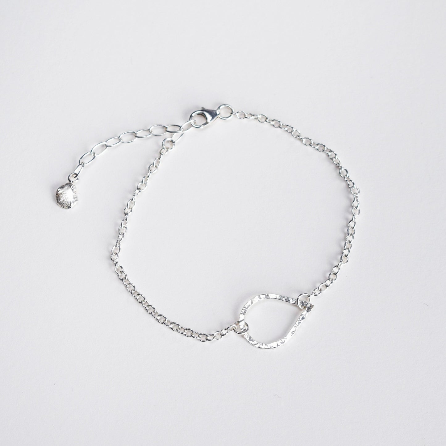 Silver teardrop bracelet on white background