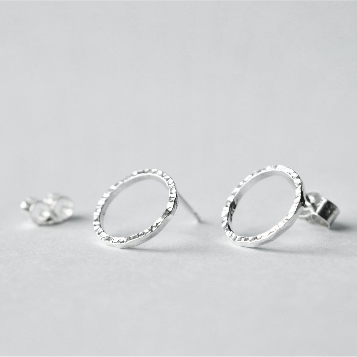 Product image of silver dash circle earrings