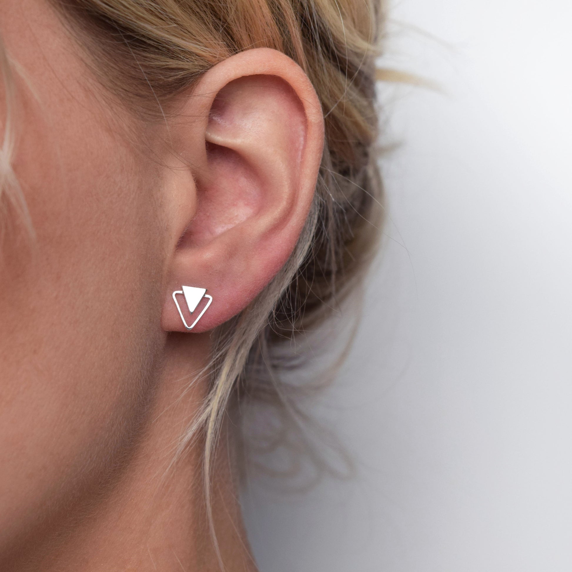 Double triangle earrings worn by model