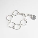 Molten link bracelet on white background