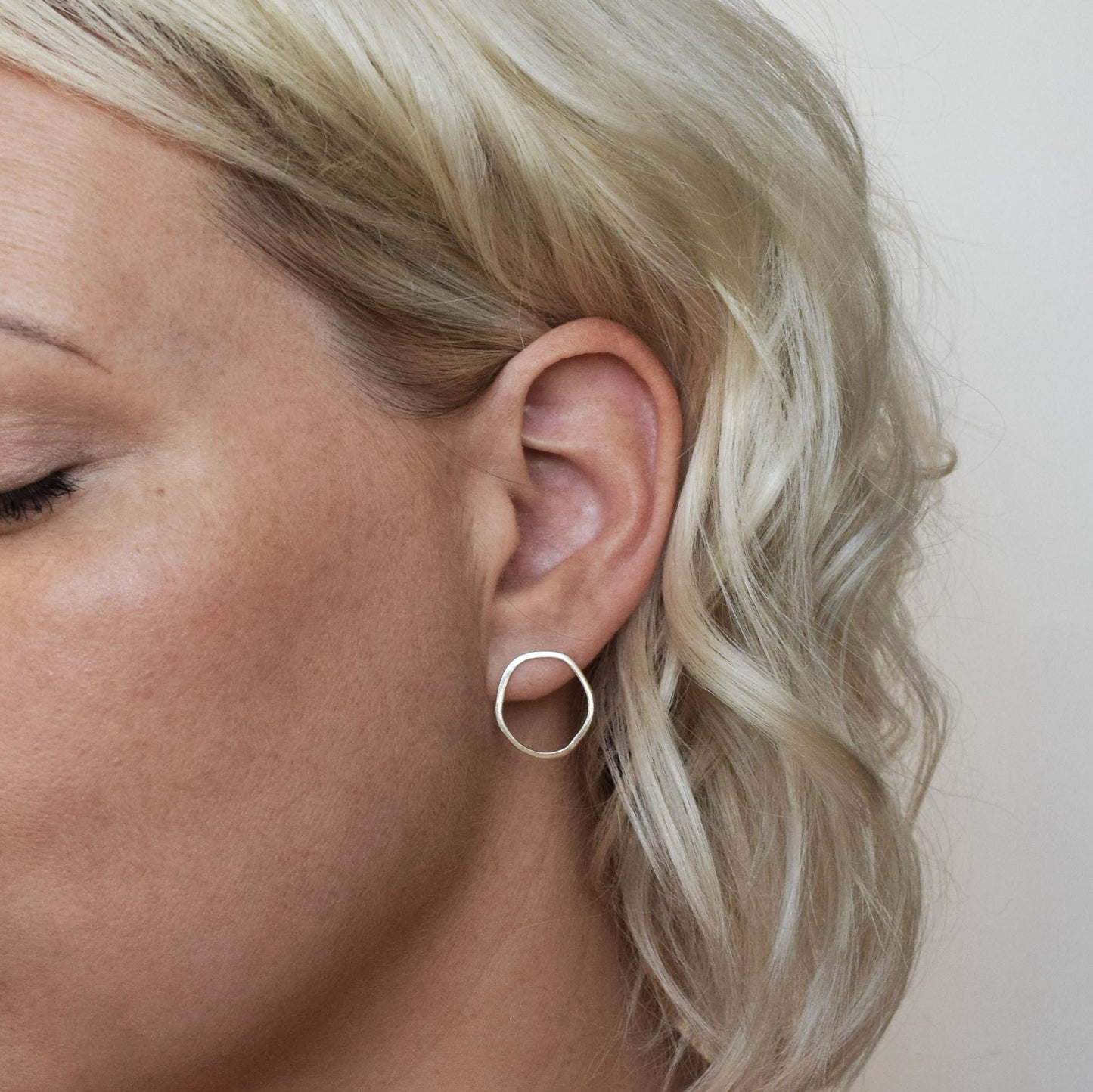 open oval stud earrings on model