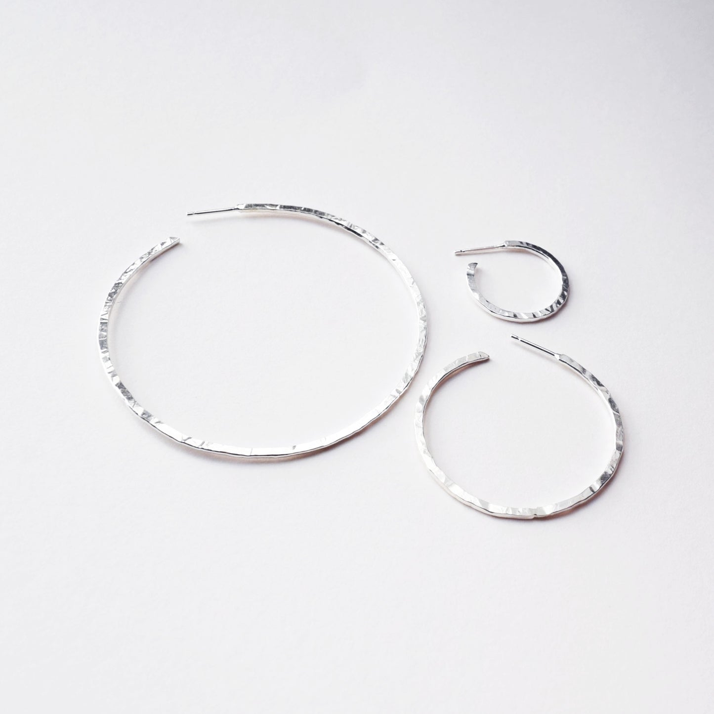 image shows three sizes of hoop earrings