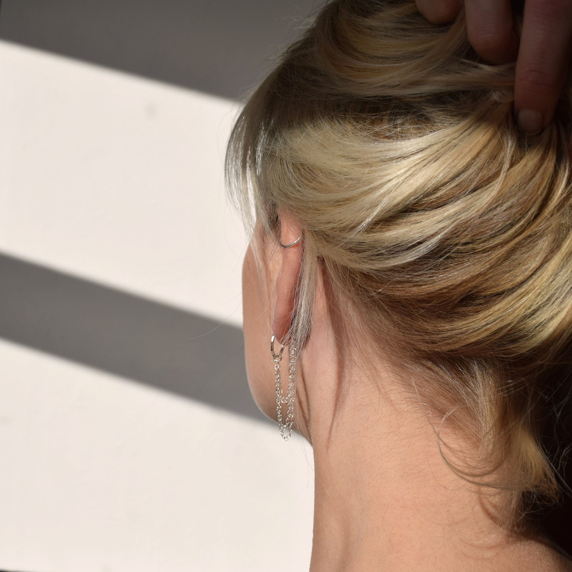 Esme earrings from the back on blond model