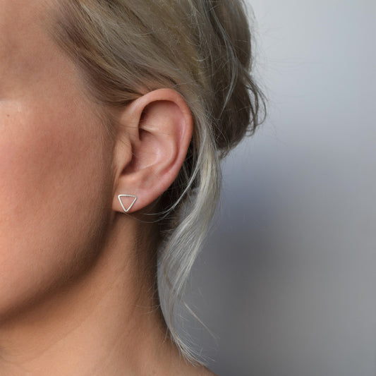 open triangle earrings on model