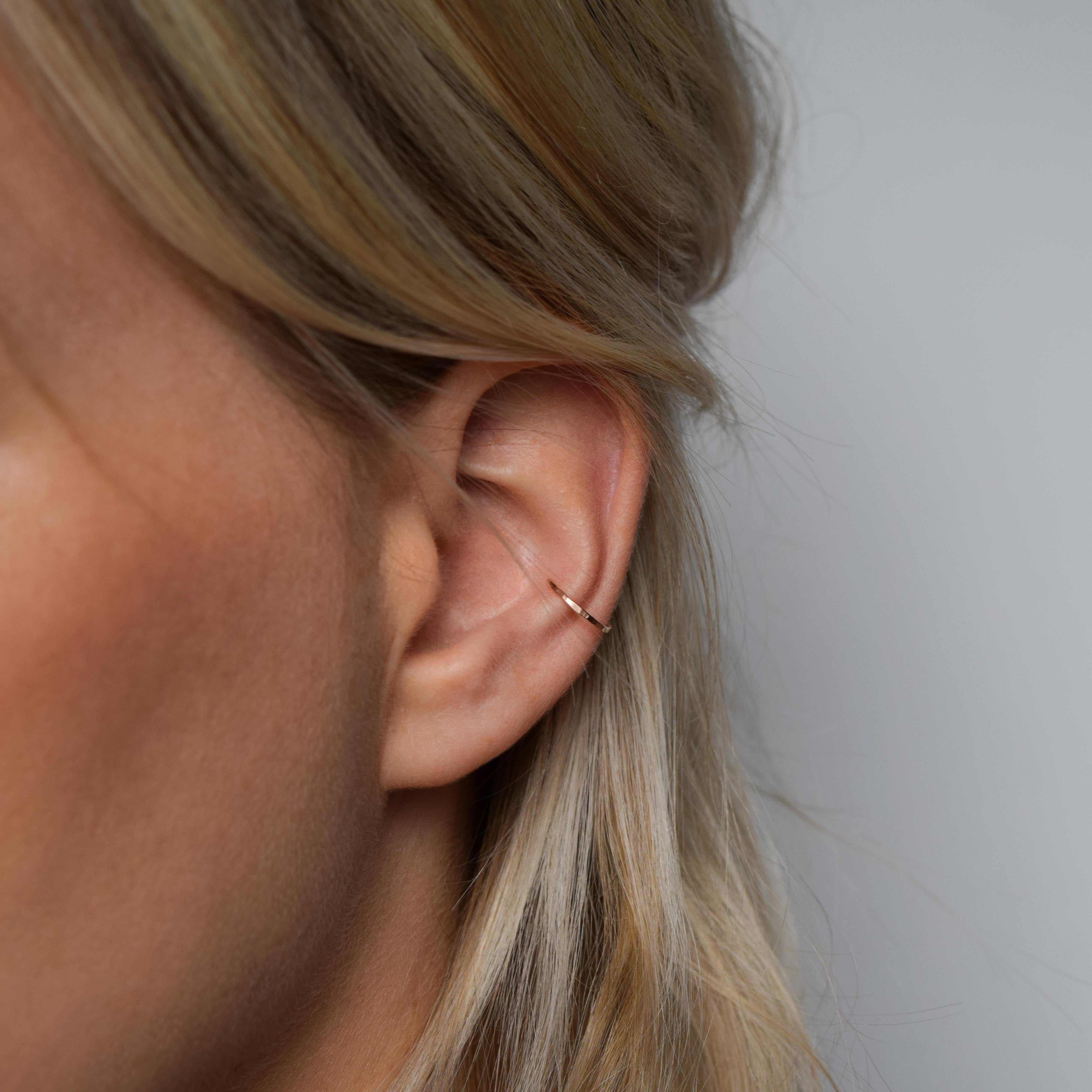 Hammered rose gold ear cuff on model