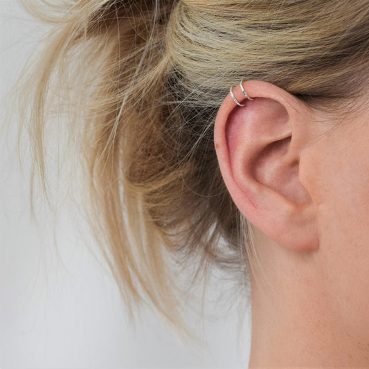 silver double helix cuff on blond haired model