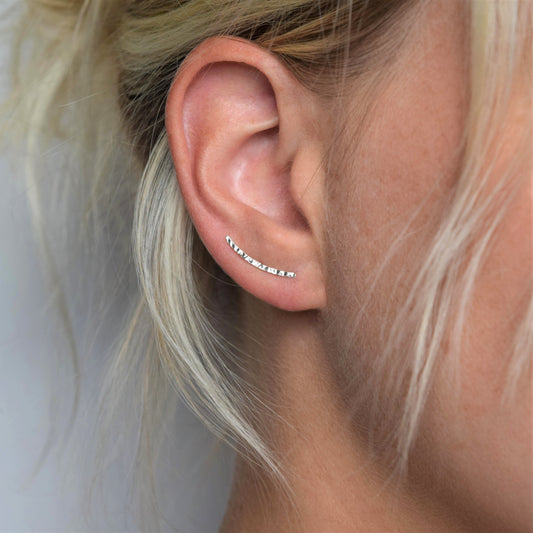 Silver hammered ear climber worn by blond model