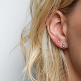 pyramid studs worn in the second piercing hole and teardrops studs in the first. Handmade in Glasgow, UK using recycled silver and gold