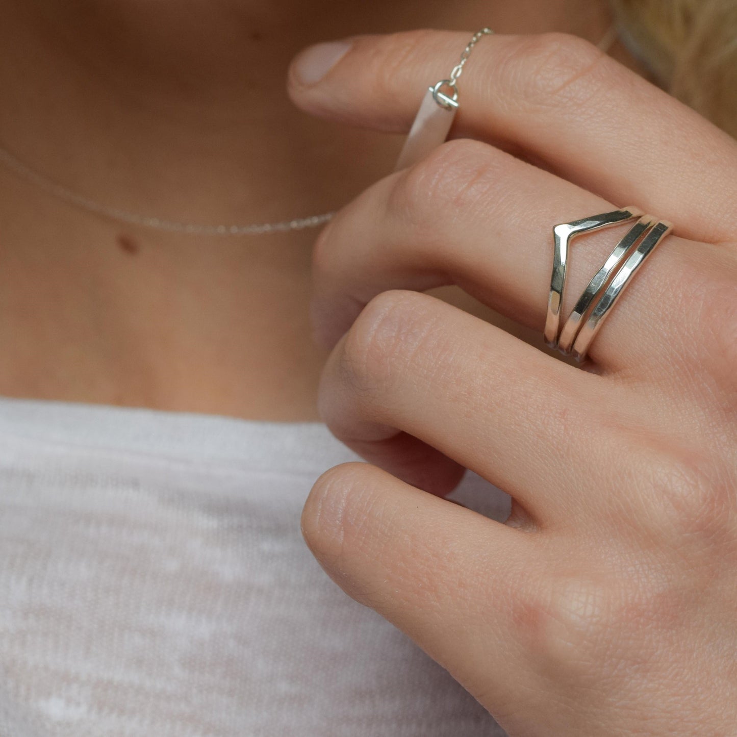 Chevron stacking rings worn together on middle finger
