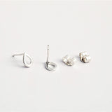 Close up product image showing teardrop studs with butterfly earring backs